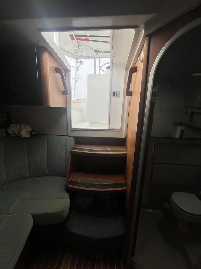 Slide: The Image of Interior of 1995 Luhrs 320 Open boat, featuring seating and steps to deck. - 14