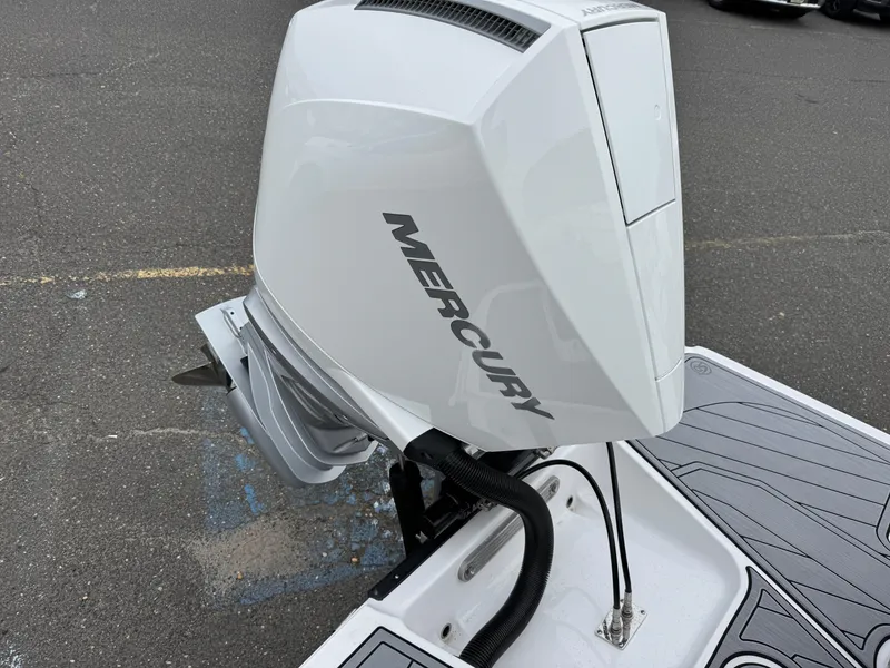 Slide: The Image of 2025 Monterey 255 Super Sport with Mercury outboard engine on a boat deck. - 11