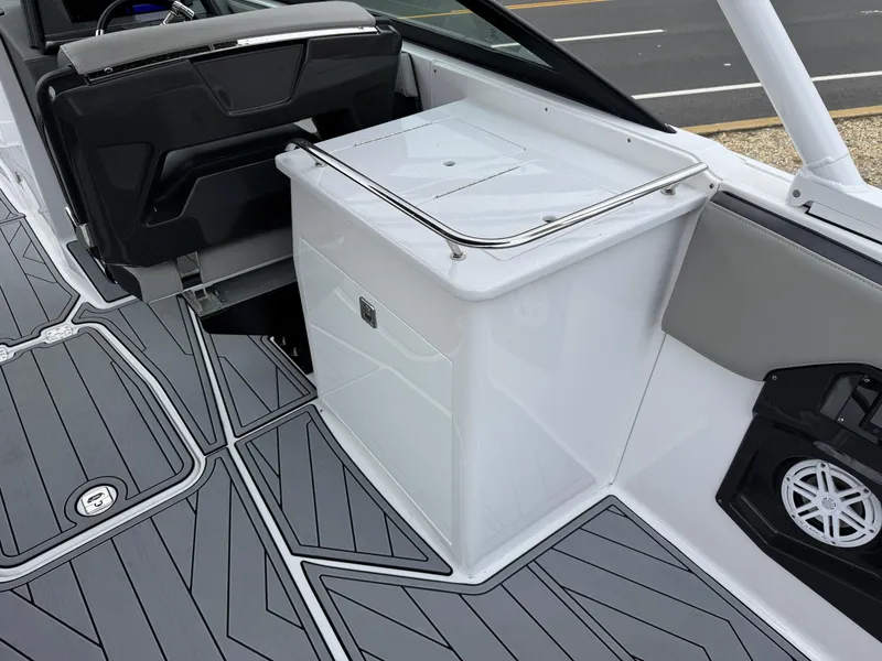 Slide: The Image of 2025 Monterey 255 Super Sport boat interior with sleek seating and storage. - 4