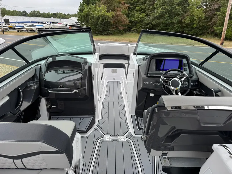 Slide: The Image of 2025 Monterey 255 Super Sport boat interior with modern dashboard and seating. - 5