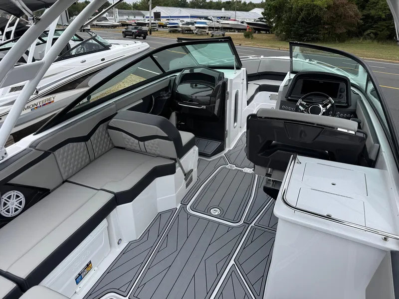 Slide: The Image of 2025 Monterey 255 Super Sport boat interior with sleek seating and modern dashboard. - 8