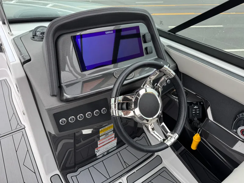 Slide: The Image of 2025 Monterey 255 Super Sport dashboard with modern steering wheel and digital display. - 9