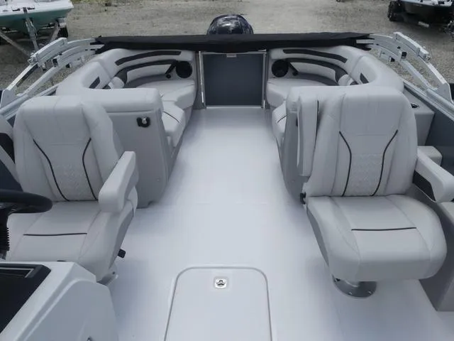 Slide: The Image of 2025 Hurricane FunDeck 2360 RE OB interior with spacious seating and modern design. - 10