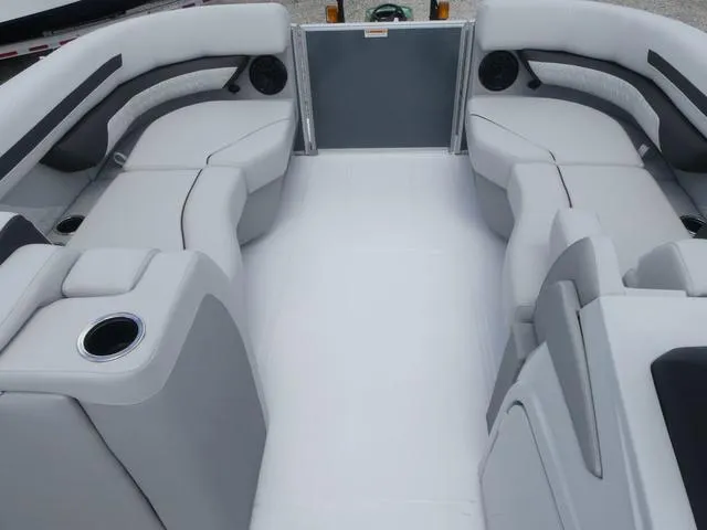 Slide: The Image of 2025 Hurricane FunDeck 2360 RE OB interior with spacious seating and cup holders. - 11
