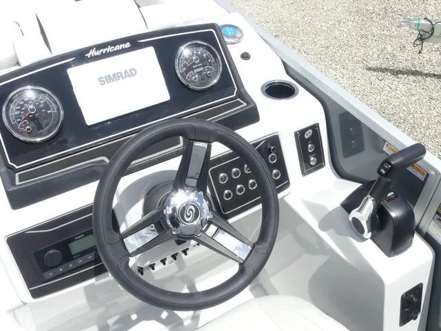 Slide: The Image of 2025 Hurricane FunDeck 2360 RE OB boat dashboard with steering wheel and controls. - 15