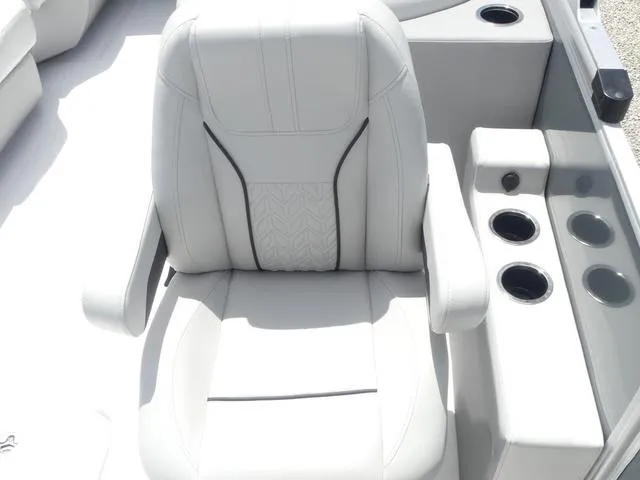 Slide: The Image of 2025 Hurricane FunDeck 2360 RE OB boat seat with cup holders, white upholstery. - 17
