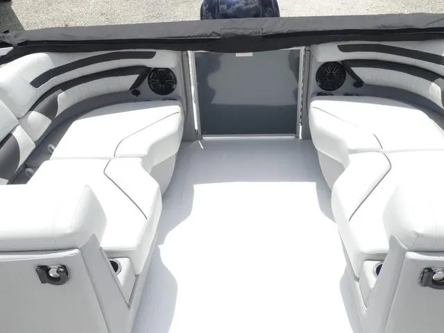 Slide: The Image of 2025 Hurricane FunDeck 2360 RE OB boat interior with white seating and modern design. - 18