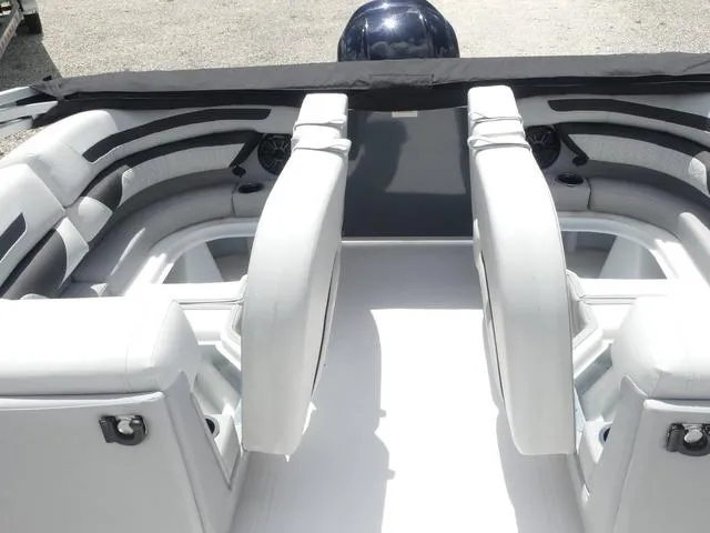 Slide: The Image of 2025 Hurricane FunDeck 2360 RE OB boat interior with white seating and modern design. - 19