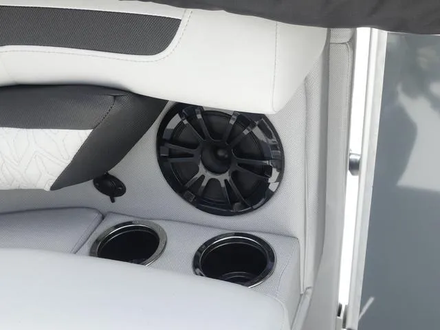 Slide: The Image of 2025 Hurricane FunDeck 2360 RE OB boat interior with speaker and cup holders. - 20