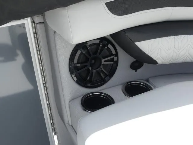 Slide: The Image of 2025 Hurricane FunDeck 2360 RE OB boat interior with speaker and cup holders. - 21