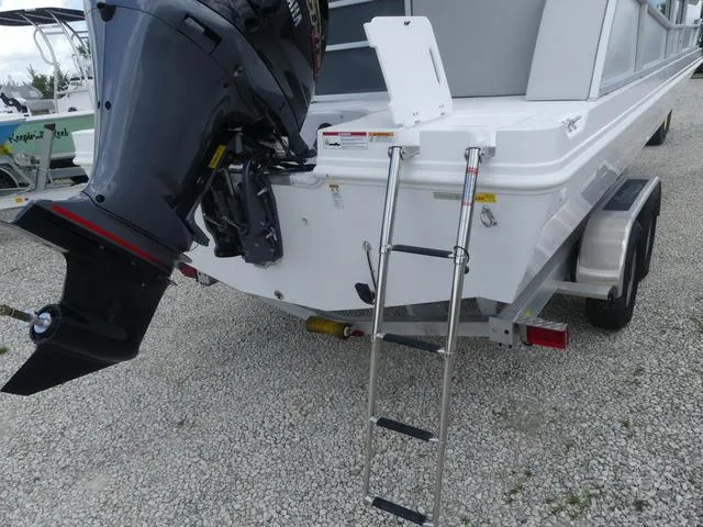 Slide: The Image of 2025 Hurricane FunDeck 2360 RE OB boat with outboard motor and boarding ladder. - 24
