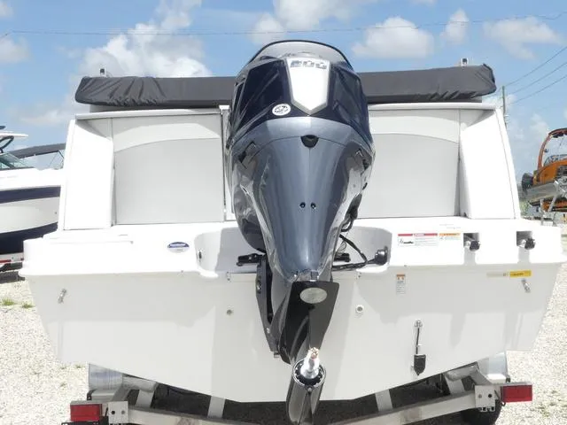 Slide: The Image of 2025 Hurricane FunDeck 2360 RE OB boat with powerful outboard motor, rear view. - 4