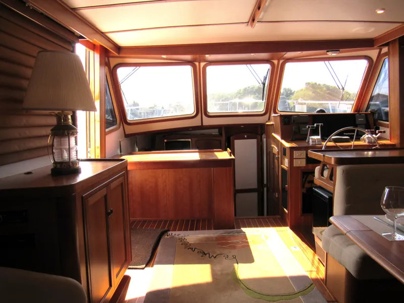 Slide: The Image of Interior of 1999 Sabre Sabreline 47 yacht with wood finish and natural light. - 10