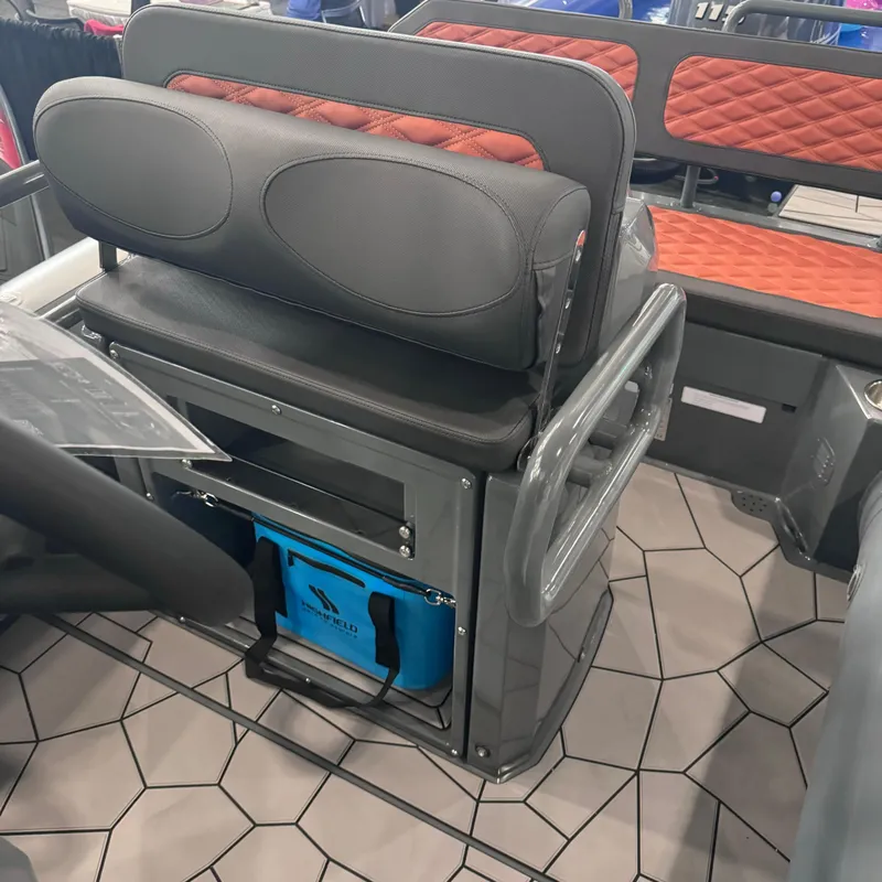 Slide: The Image of 2025 Highfield Sport 560 boat interior with cushioned seating and storage. - 13