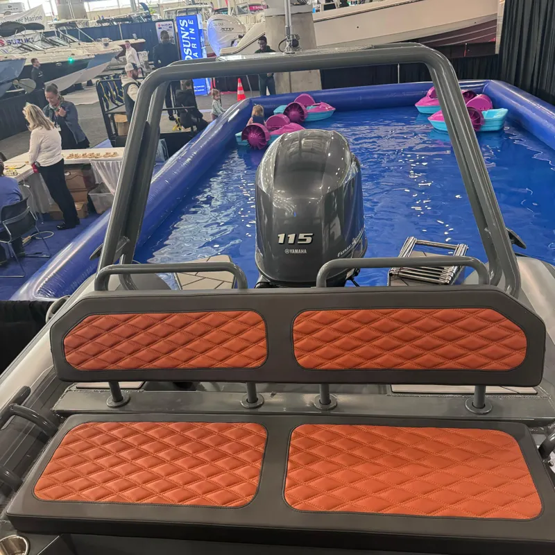 Slide: The Image of Highfield Sport 560 boat, 2025 model, with Yamaha 115 engine at indoor display. - 15