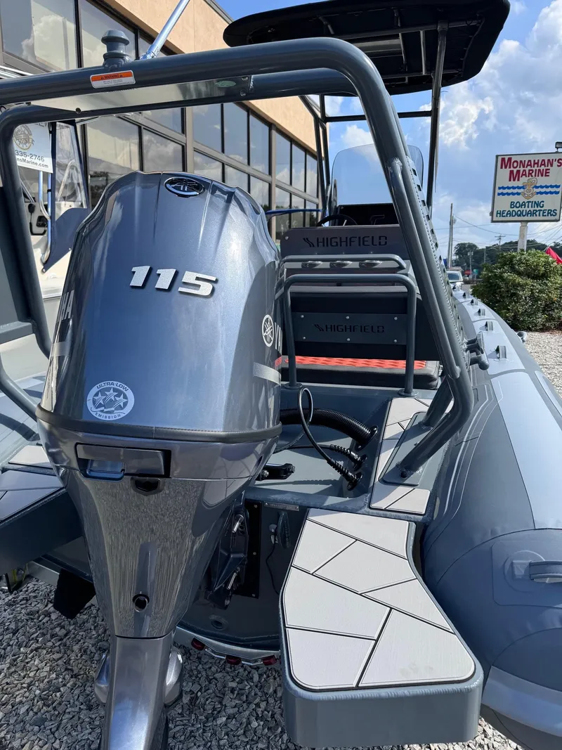 Slide: The Image of 2025 Highfield Sport 560 boat with 115 HP engine displayed outdoors. - 9