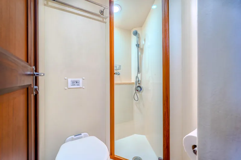 Slide: The Image of Bathroom interior of 1982 Hatteras 46 Convertible yacht with shower and toilet. - 21