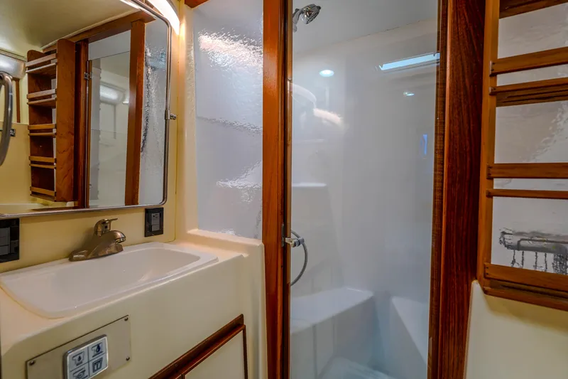 Slide: The Image of 1982 Hatteras 46 Convertible yacht bathroom with shower and sink. - 24
