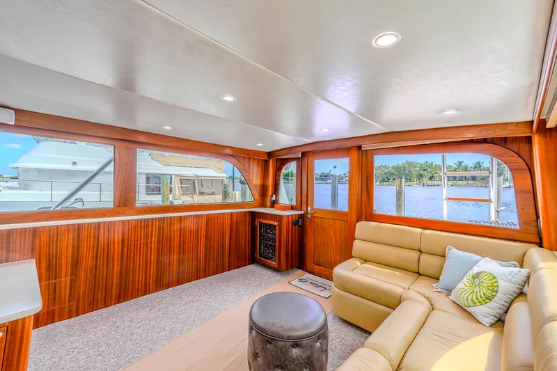 Slide: The Image of Luxurious 1982 Hatteras 46 Convertible yacht interior with leather seating and scenic water views. - 26