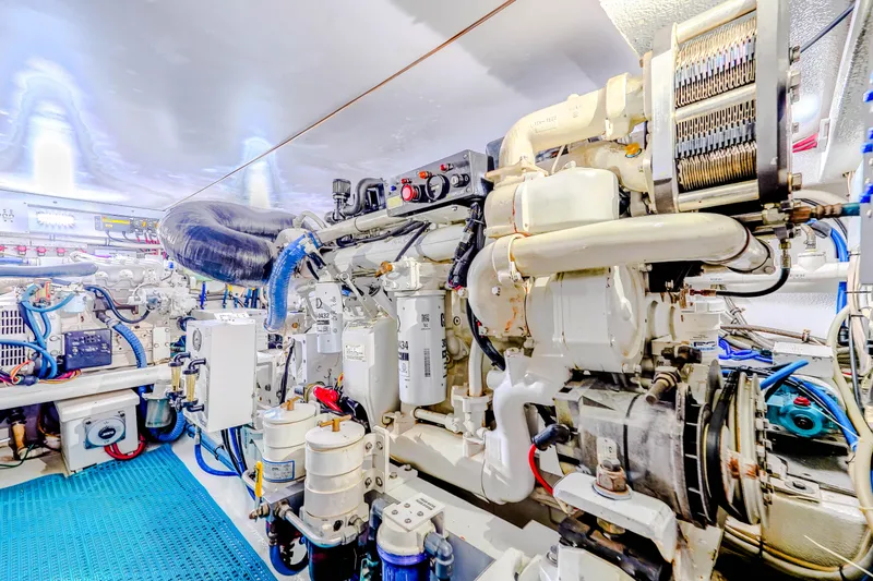 Slide: The Image of Engine room of 1982 Hatteras 46 Convertible yacht, showcasing mechanical components and systems. - 28
