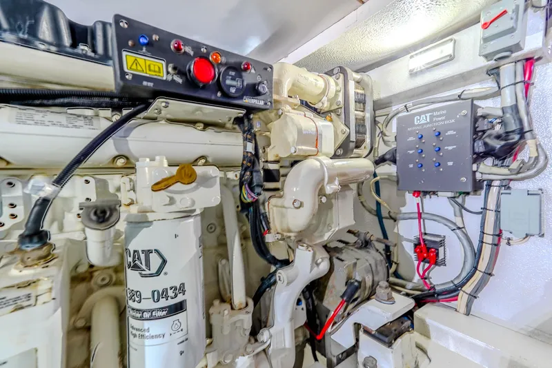 Slide: The Image of Engine room of 1982 Hatteras 46 Convertible with CAT machinery and control panel. - 31