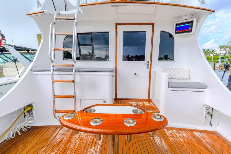 Slide: The Image of 1982 Hatteras 46 Convertible yacht deck with ladder and seating area. - 40
