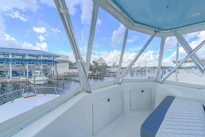 Slide: The Image of 1982 Hatteras 46 Convertible yacht interior with marina view. - 44