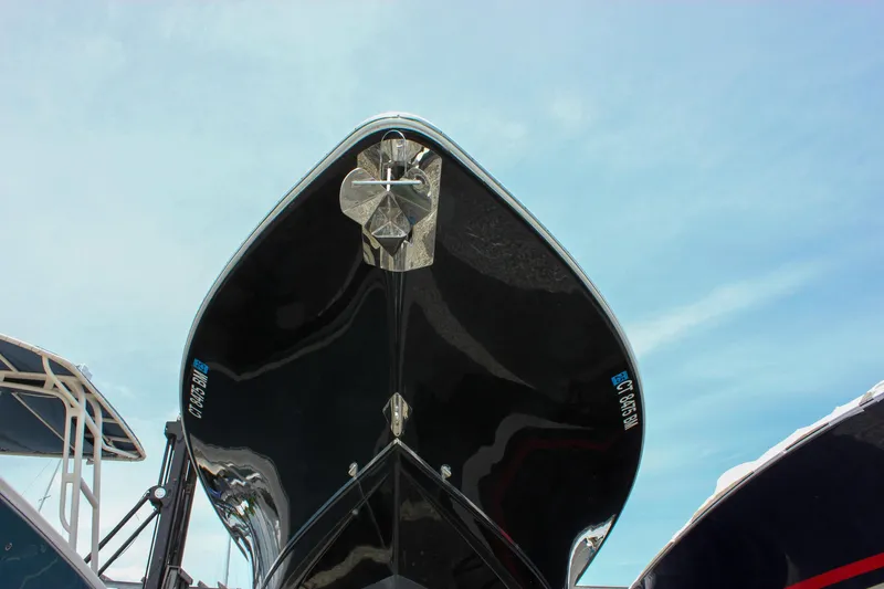 Slide: The Image of 2022 Sea Hunt Gamefish 27 Forward Seating boat, viewed from below against blue sky. - 13