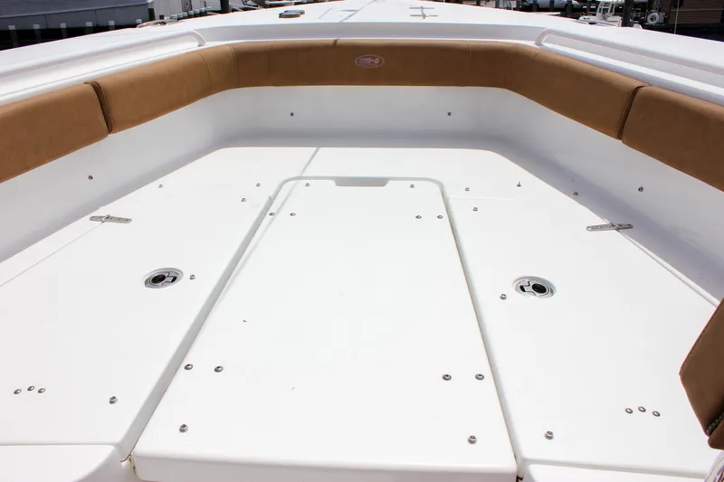 Slide: The Image of 2022 Sea Hunt Gamefish 27 Forward Seating, spacious deck with cushioned seating. - 15