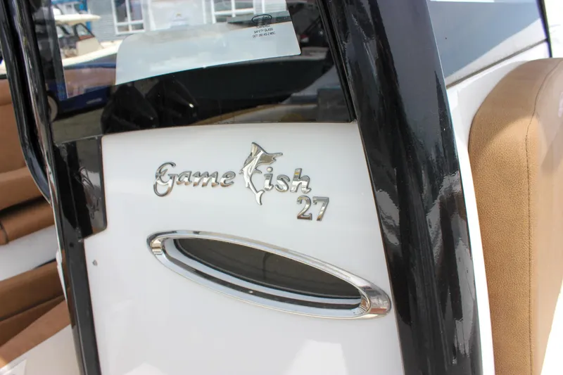 Slide: The Image of 2022 Sea Hunt Gamefish 27 Forward Seating boat interior with logo detail. - 18