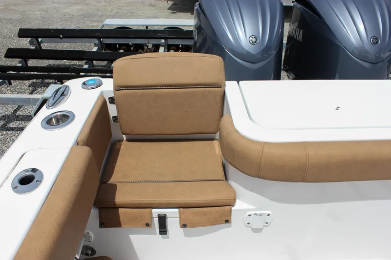 Slide: The Image of 2022 Sea Hunt Gamefish 27 Forward Seating with tan upholstery and dual Yamaha engines. - 22