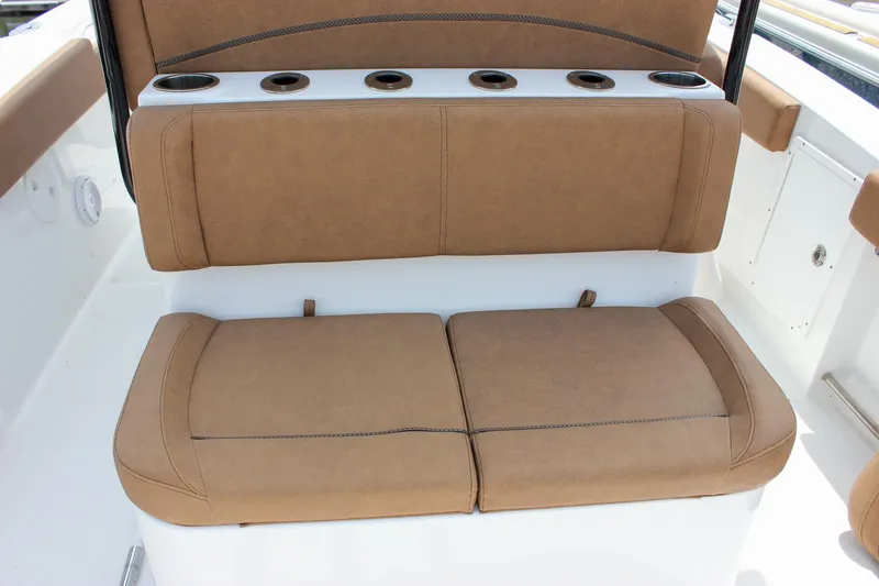 Slide: The Image of 2022 Sea Hunt Gamefish 27 Forward Seating with tan cushions and rod holders. - 27