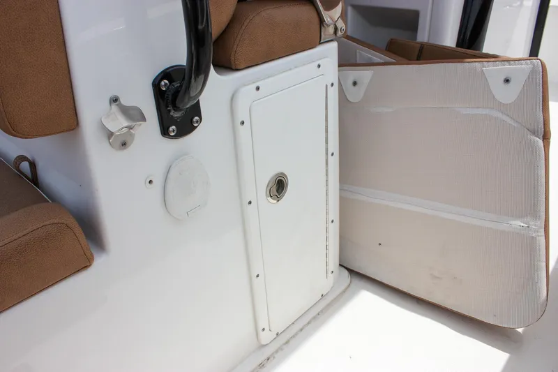 Slide: The Image of 2022 Sea Hunt Gamefish 27 boat interior with storage compartment and seating. - 30