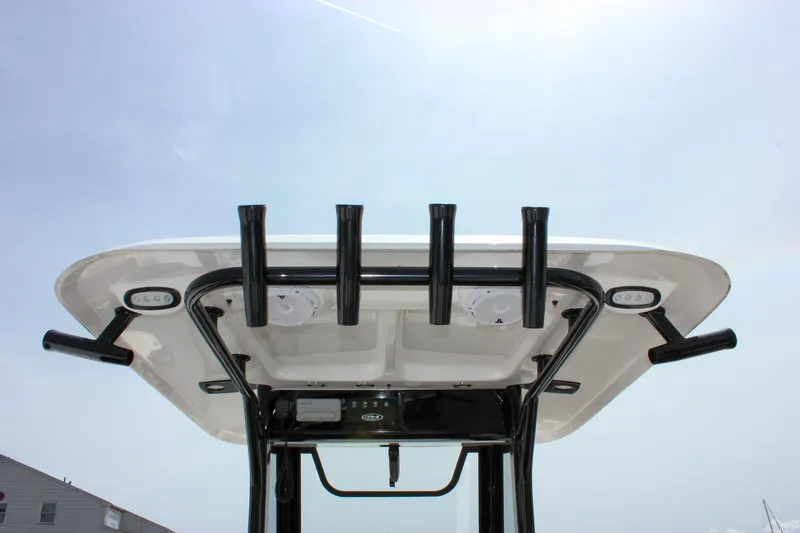 Slide: The Image of 2022 Sea Hunt Gamefish 27 T-top with rod holders and lights, viewed from below. - 32