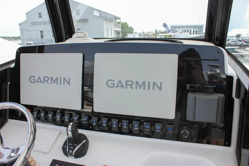Slide: The Image of Control panel of 2022 Sea Hunt Gamefish 27 with dual Garmin displays. - 36