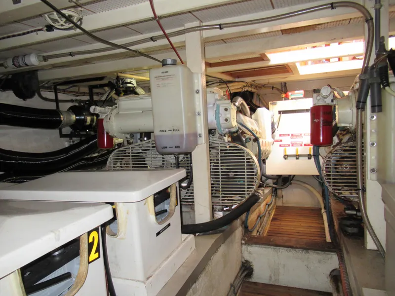 Slide: The Image of Engine room of 1985 Grand Banks 42 Classic yacht, showcasing mechanical components and equipment. - 15