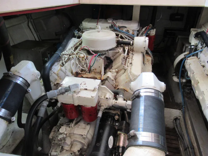 Slide: The Image of Engine room of a 1985 Grand Banks 42 Classic yacht, showcasing mechanical components. - 19
