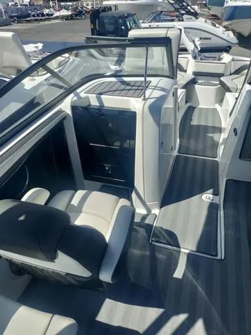 Slide: The Image of 2019 Yamaha Boats 242 Limited S E-Series interior with seating and dashboard view. - 13
