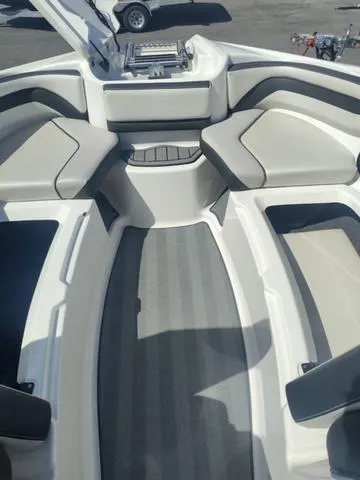 Slide: The Image of 2019 Yamaha Boats 242 Limited S E-Series interior with spacious seating and sleek design. - 15