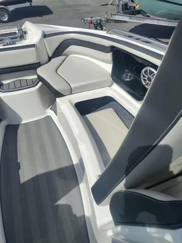Slide: The Image of 2019 Yamaha Boats 242 Limited S E-Series interior with sleek seating and modern design. - 16