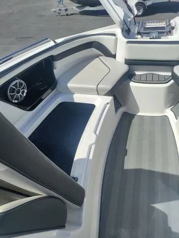 Slide: The Image of 2019 Yamaha Boats 242 Limited S E-Series interior with seating and speaker system. - 17