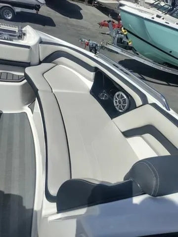 Slide: The Image of 2019 Yamaha Boats 242 Limited S E-Series interior seating with sleek design and modern features. - 19