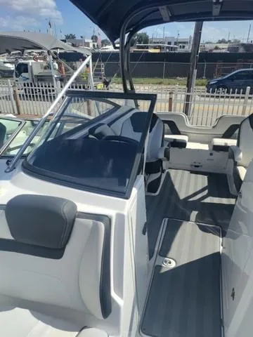 Slide: The Image of 2019 Yamaha Boats 242 Limited S E-Series interior with seating and helm. - 21
