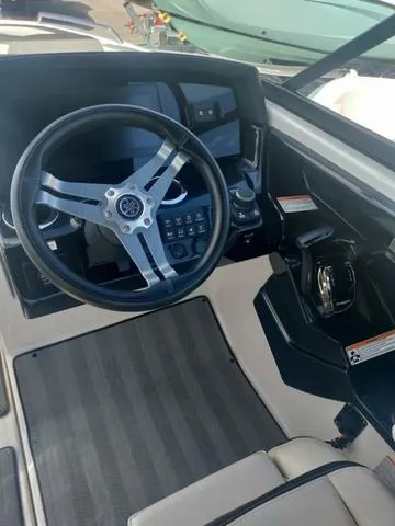 Slide: The Image of 2019 Yamaha Boats 242 Limited S E-Series dashboard with steering wheel and controls. - 25