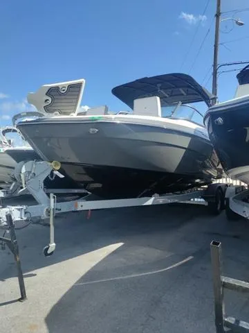Slide: The Image of 2019 Yamaha Boats 242 Limited S E-Series on trailer, parked outdoors under clear sky. - 3