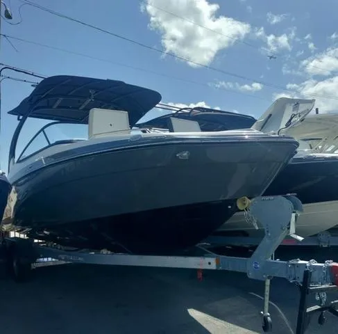 Slide: The Image of 2019 Yamaha Boats 242 Limited S E-Series on trailer under blue sky. - 4