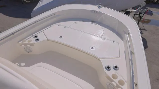 Slide: The Image of 2024 Boston Whaler 210 Montauk boat interior, featuring spacious deck and storage compartments. - 17