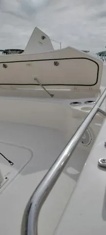 Slide: The Image of 2024 Boston Whaler 210 Montauk boat interior with sleek design and stainless steel railing. - 26