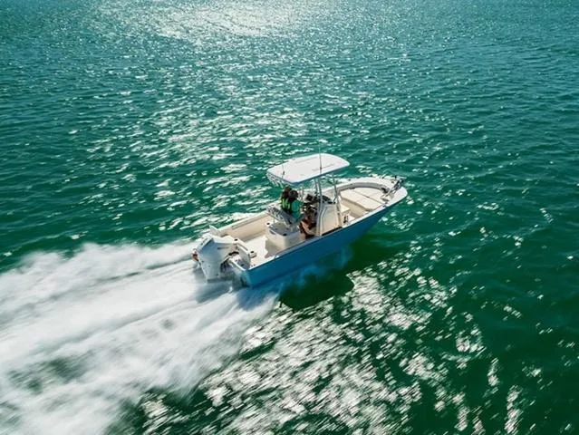 Slide: The Image of 2024 Boston Whaler 210 Montauk speeding on open water. - 32