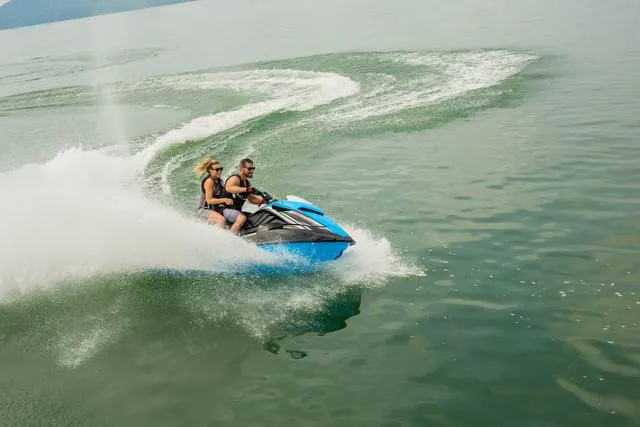 Slide: The Image of 2024 Yamaha Waverunner GP HO™ with Audio speeding on a lake. - 13